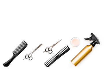 Professional tools for haircut. Sciccors, comb, spray on white background top view copy space