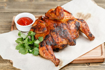 grilled chicken. Serving on a wooden Board on a rustic table. Barbecue restaurant menu, a series of photos of different meats