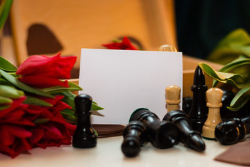 Naklejka na ściany i meble Bouquet of red tulips, chocolate hearts and chess