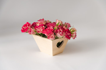 beautiful romantic small bouquet of pink roses in wood box decor