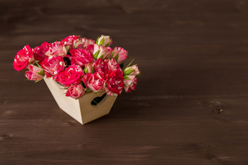 beautiful romantic small bouquet of pink roses in wood box decor