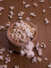 Homemade popcorn in a wooden bowl on the table