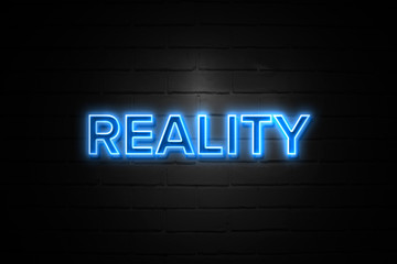 Fototapeta na wymiar Reality neon Sign on brickwall