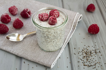 Pudding with chia and raspberries  on the grey napkin