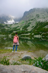 Teenager girl hiking in mountains. Travel Tatry, Slovakia