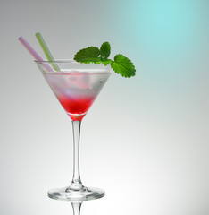 Transitional pink martini drink glass with 2 straws