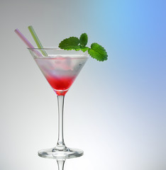 Transitional pink martini drink glass with 2 straws