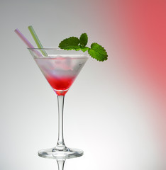 Transitional pink martini drink glass with 2 straws