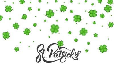 St. Patrick's Day. Clover shamrock leaves background and St. Patrick's lettering. St. Patricks Day background