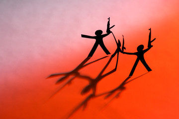 Black Paper figures with automatic guns. Terror.