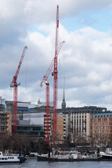 Tower cranes on the banks of the river Thames, London 