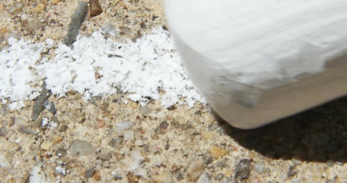Making a Chalk Line on Concrete Pavement Macro Close Up, 4K
