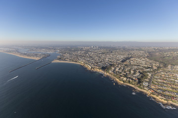 Fototapeta na wymiar Aerial view of of Corona del Mar, Newport Beach and the entrance to Balboa Bay on the scenic Orange County California coast. 