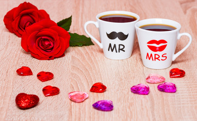 Fototapeta na wymiar Valentines Day background with two coffee cups, hearts and rose flowers