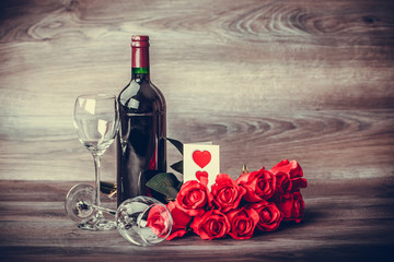 Wine and red roses