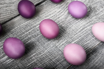 Obraz na płótnie Canvas Easter eggs in fashionable colors on a gray wooden background