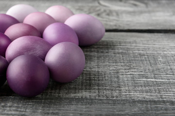 Easter eggs in fashionable colors on a gray wooden background