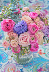 Beautiful bouquet of spring flowers in a vase on the table. Lovely bunch of flowers . 