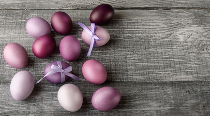 Easter eggs in fashionable colors on a gray wooden background