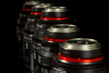 Fototapeta na wymiar Professional Cinema Lens - concept of camera lenses on the mirroring black background.