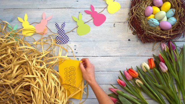 Easter celebration symbols top view persong holding card