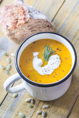 Mug of pumpkin cream soup