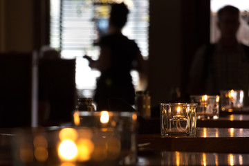 Oil lamps on tables.