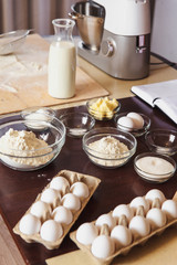 Baking ingredients on kitchen table. White products prepare for cooking. Lifestile food concept.