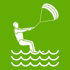 man takes part at kitesurfing icon green