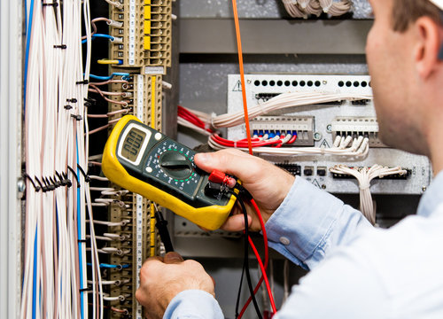 Engineer Checking Power Supply