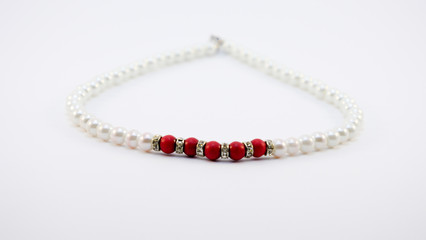 Elegant white pearl necklace isolated on white background