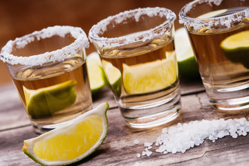 Tequila shots with lime fruits and salt 