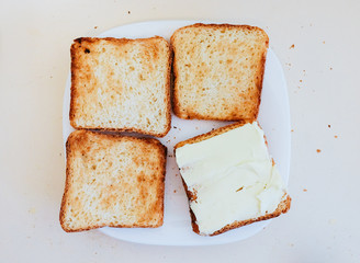 Four toasts on the white plate