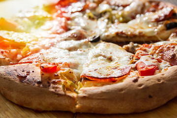 Sausage pizza salt on a wooden stand.