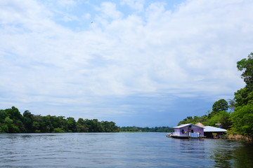 Fototapeta na wymiar Houses along Amazonas river. Brazilian panorama