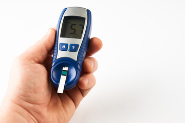 Man checking blood sugar level