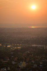 Beautiful sunset in Mandalay, Myanmar (Burma), viewed from above from the Mandalay Hill. Copy space. 