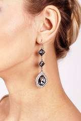 Women's ear in jewelry earrings close up