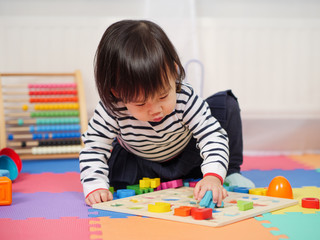 baby girl learning alphabet at home