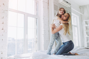 Mom and daughter having fun at home