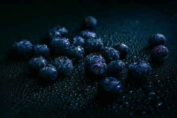 Blueberry fruit on stone background. Healthy forest fruit. Delicious fresh berries.