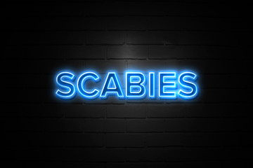 Scabies neon Sign on brickwall