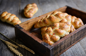 Braided bread rolls with red bell pepper, chili and chia seeds