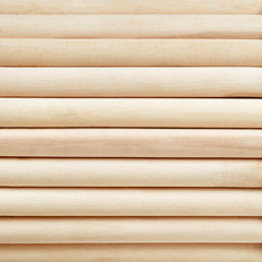 Light cylinder wooden background.