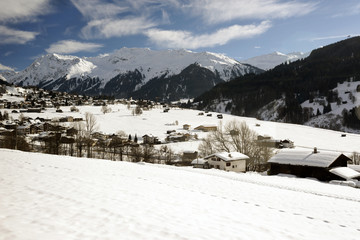 Fototapeta na wymiar A panorama view of beautiful swiss village in the alps switzerland in winter