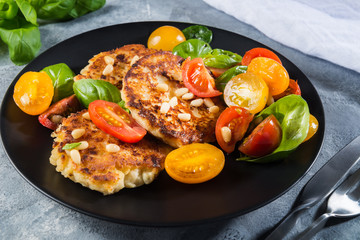 Ricotta pancakes with spinach, tomatoes, basil and pine nuts sal