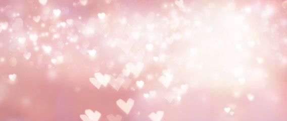 Beautiful shiny hearts and abstract lights background