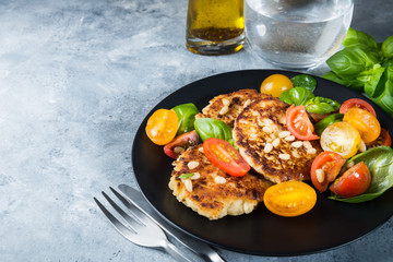 Ricotta pancakes with spinach, tomatoes, basil and pine nuts sal