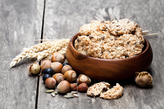Healthy  protein granola crackers with seeds and nuts in wooden bowl