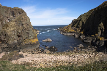 Fototapeta na wymiar Beautiful landscape. Cliffs, rocks and the sea. Peterhead in Scotland, Aberdeenshire, United Kingdom.